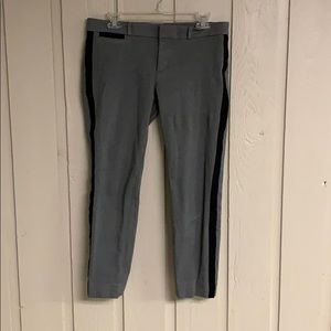 Ankle length grey work pants.